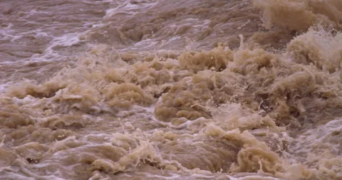 Slow-motion - Muddy stream after heavy rain Righy to left FIX Stock Footage 159304868