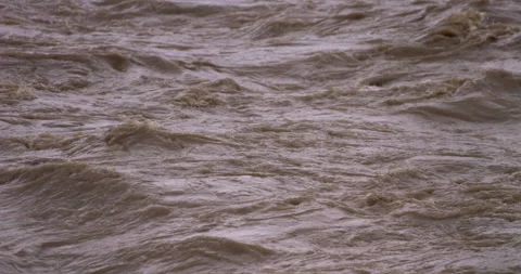 Slow-motion - Muddy stream after heavy rain Righy to left FIX Stock Footage 159305745