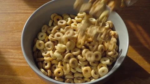 Slow motion – Multi grain hoops cereal being poured into a bowl. Stock Footage 162676005