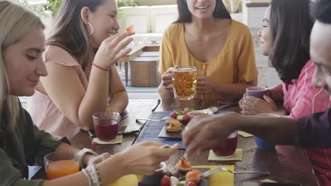 Slow motion Multicultural People having breakfast drinking coffee and cheers Stock Footage 183589721