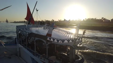 Slow Motion of Multiple egyption Local felucca tour boat on Nile river Vidéo 239963153