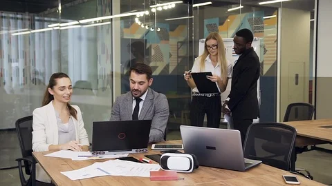 Slow motion of multiracial considerate young business colleagues which working Stock Footage 124662429