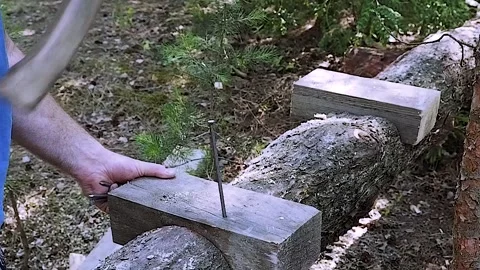 Slow motion. The nail is hammered into the board. construction Stock-Footage 156937958