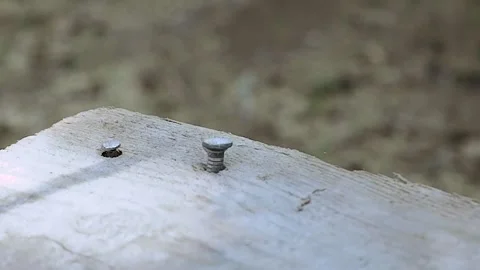 Slow motion. The nail is hammered into the board. construction Stock Footage 156937960