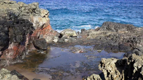 Slow motion of the Nakalele Blowhole exploding on rocks in Maui, Hawaii. Stock Footage 167405871