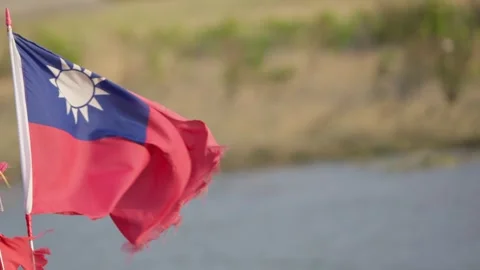 Slow motion of national flags waving in the wind by riverside on sunny afternoon Stock Footage 312278135