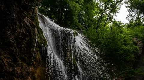 Slow motion natural waterfall in the forest Видео 48634960