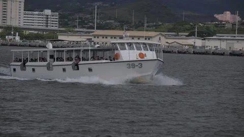 Slow Motion Navy Boat Shuttling Tourists, Pearl Harbor National Memorial, Hawaii Stock Footage 154500251