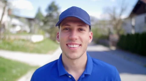 Slow motion of a nice young guy with blue hat smiling in camera 스톡 동영상 49787658