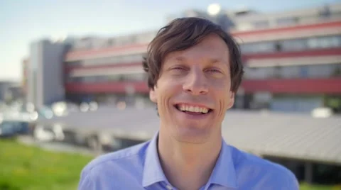 Slow motion of a nice young man laughing and watching in camera Stock-Footage 49726129