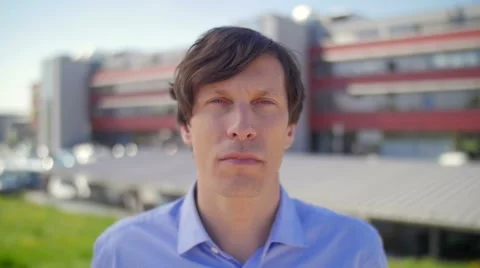 Slow motion of a nice young man watching serious in camera Stock-Footage 49726560