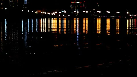 Slow motion night view along a river in Japan beautiful ripples,4K 動画素材 347734805