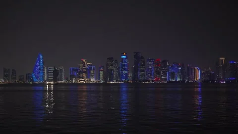 Slow motion night view of the illuminated West Bay skyscraper skyline, Doha. Stock Footage 339323785