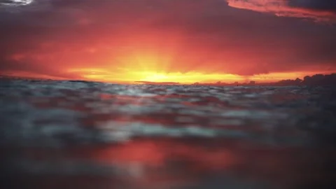 Slow Motion Ocean Sunset at Water Level With Rolling Waves Stock Footage 326096130