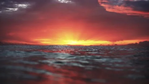Slow Motion Ocean Sunset With Waves at Water Level Stock Footage 326096171