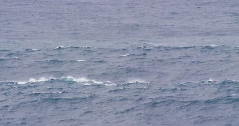 Slow motion of ocean water waves picking up on intensity with increasing wind Stock Footage 156132929