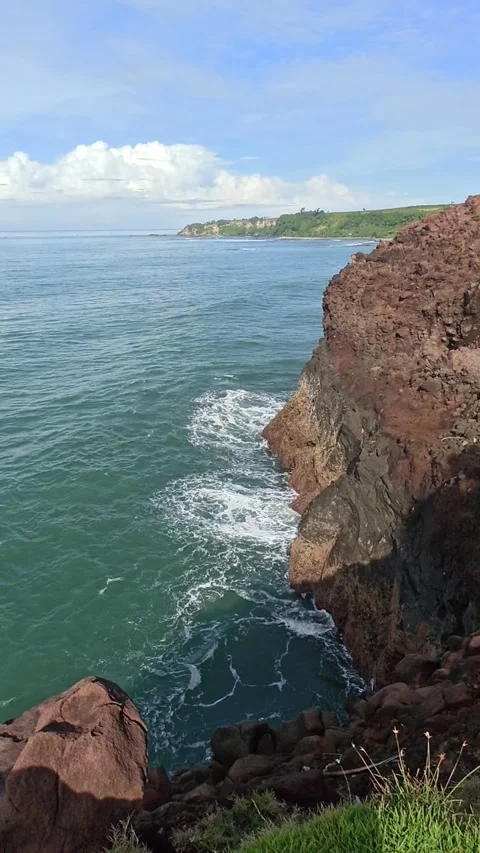 Slow Motion ocean wave and rock in Garut Stock Footage 167854099