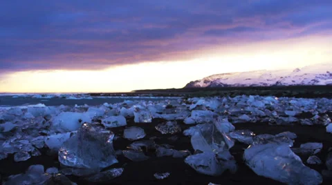 Slow motion of ocean wave beat on Iceberg stuck Stock Footage 33988379