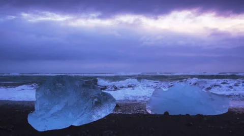 Slow motion of ocean wave beat on Iceberg stuck Stock Footage 33988572
