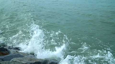Slow motion ocean wave hit rock beside seaside Stock Footage 68362748