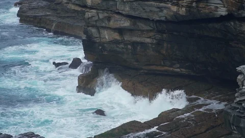 Slow motion ocean wave hit rocky stone near coast Stock Footage 125112742