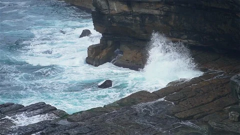Slow motion ocean wave hit rocky stone near coast Stock Footage 125112933