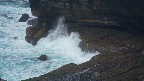 Slow motion ocean wave hit rocky stone near coast Stock Footage 125113149