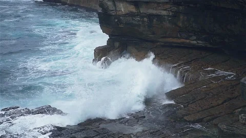 Slow motion ocean wave hit rocky stone near coast Stock Footage 125113166