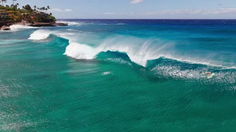 Slow Motion Ocean Wave Rolling Through and Breaking in Clear Turquoise Water Stock Footage 326014156