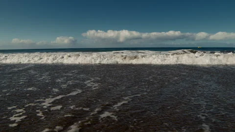 Slow Motion Ocean Wave, sandy coastline Stock Footage 247075551