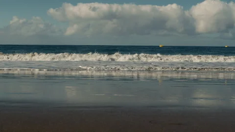 Slow Motion Ocean Wave, sandy coastline Stock Footage 247078140