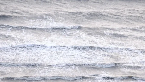 Slow motion of ocean wave with sunset or sunrise light Видео 102822525