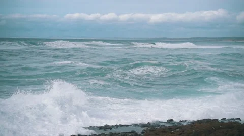 Slow Motion Ocean Waves Breaking on Shore Stock Footage 55784529