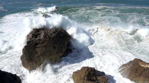 Slow Motion Ocean Waves Breaking on Rocks Stock Footage 55788675