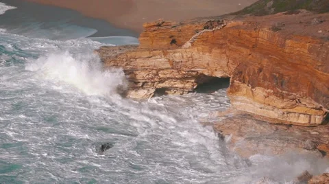 Slow Motion Ocean Waves Breaking on Rocks Stock Footage 59100383