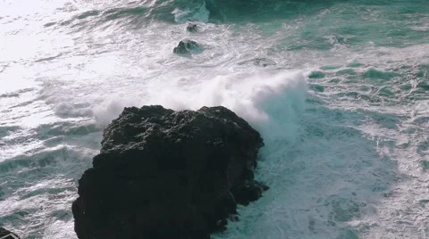 Slow Motion Ocean Waves Breaking on Rocks Stock Footage 59100424