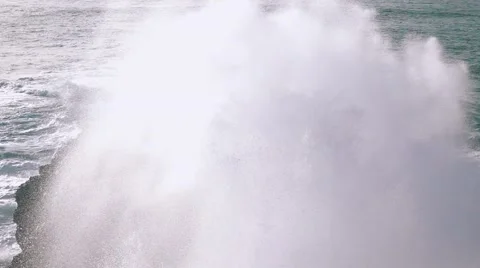 Slow Motion Ocean Waves Breaking on Rocks Stock Footage 59101141