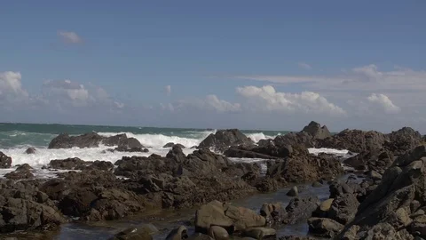 SLOW MOTION: Ocean waves crash on rocks shore (180fps) Stock-Footage 84153363