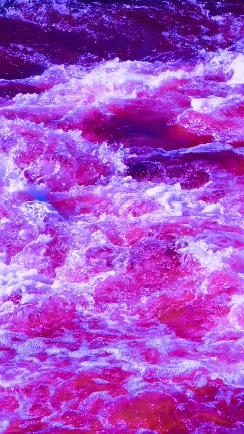Slow motion of ocean waves crashing with surreal pink and purple tones. Stock Footage 306678519