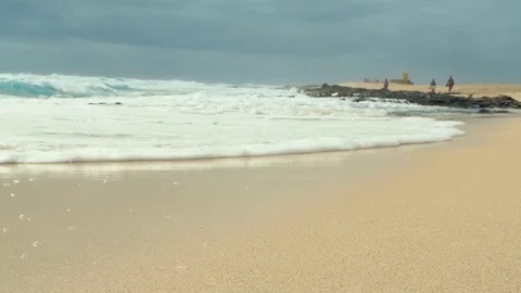 Slow motion ocean waves over sand beach in Fuertevenura Stock-Footage 76883413