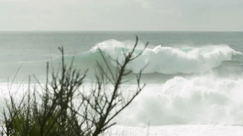 Slow motion of ocean waves rising up from surface as wind picks up on cloudy day Stock Footage 156082626