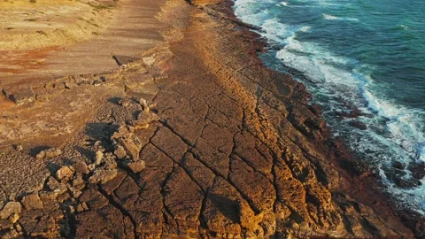Slow motion ocean waves rolling to the rocky shore. Beautiful seascape. Aer.. Stock Footage 225745313