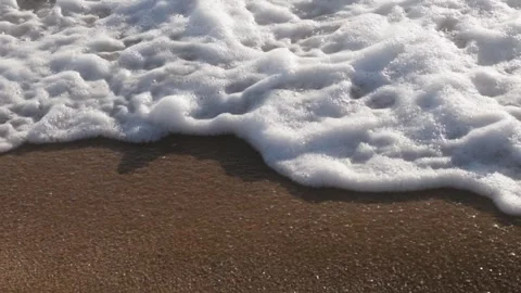 Slow Motion Ocean Waves Rolling Onto Sandy Beach With Golden Light Texture Видео 333296405