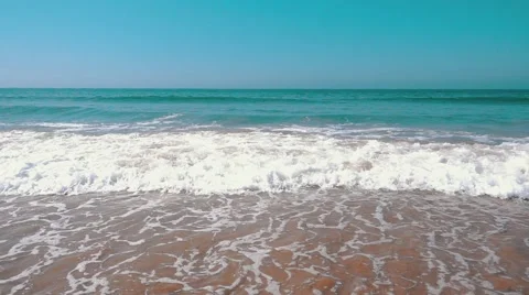 Slow Motion Ocean Waves with Sun Reflection Stock Footage 55243327