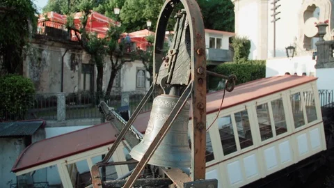 Slow motion: old bell and car cable in europian city Stock Footage 128091244