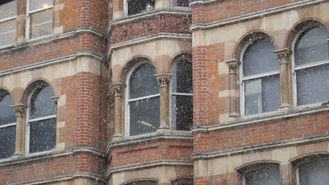 Slow Motion. An old building during a snowfall. Stock Footage 147231370