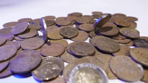 Slow motion of old coin falling on pile Stock Footage 287742672