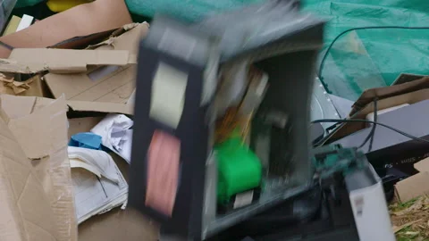 Slow Motion: Old computer is thrown into large trash heap or rubbish dump Video stock 153566070