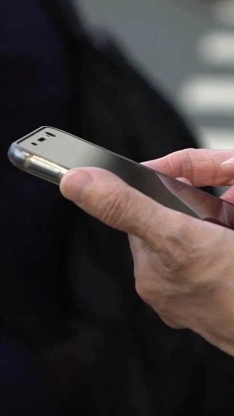 Slow motion of old hand grandma in street using smartphone and texting. Stock Footage 331245659