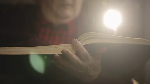 SLOW MOTION: Old human reading a book. Close up Stock Footage 43655692